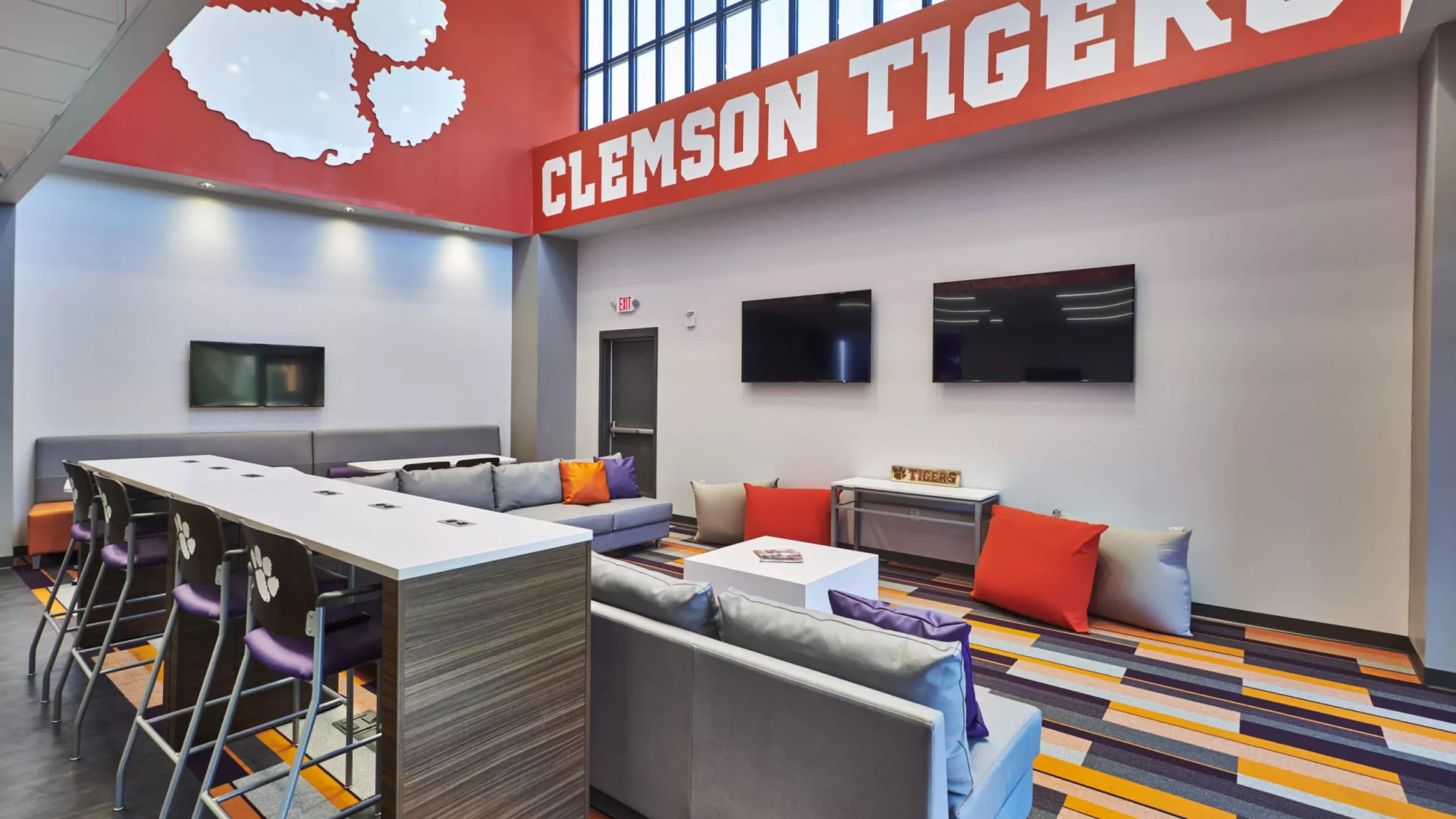 Softball lounge with dimensional logo and wall graphics.