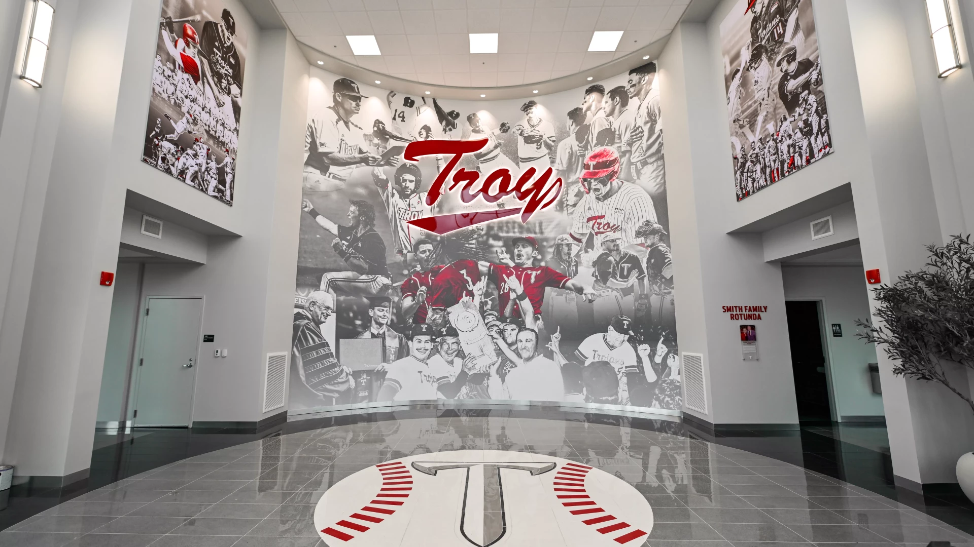 large wall graphics in lobby of Troy's baseball stadium