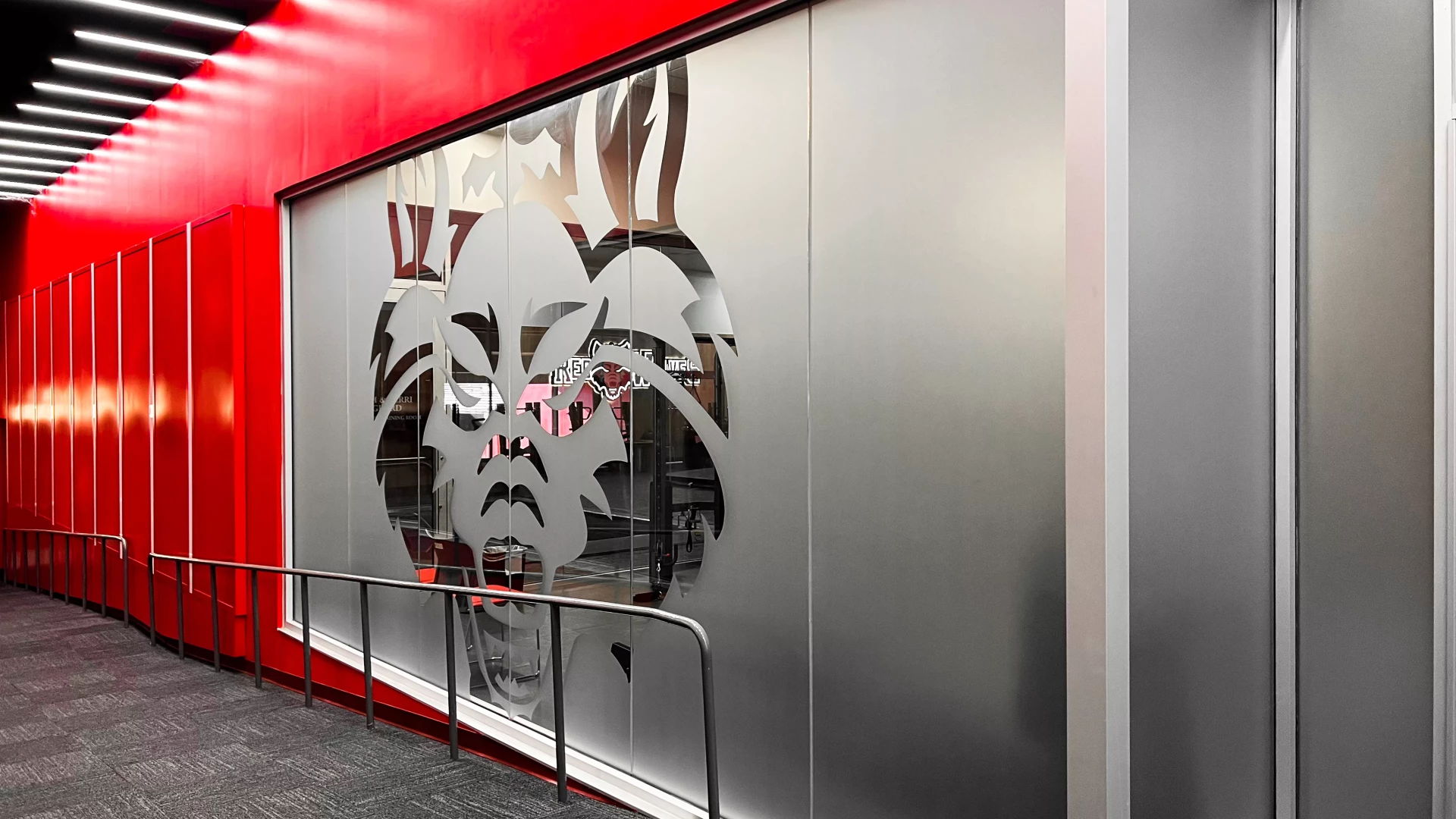 Corridor with wolf logo in frosted glass.