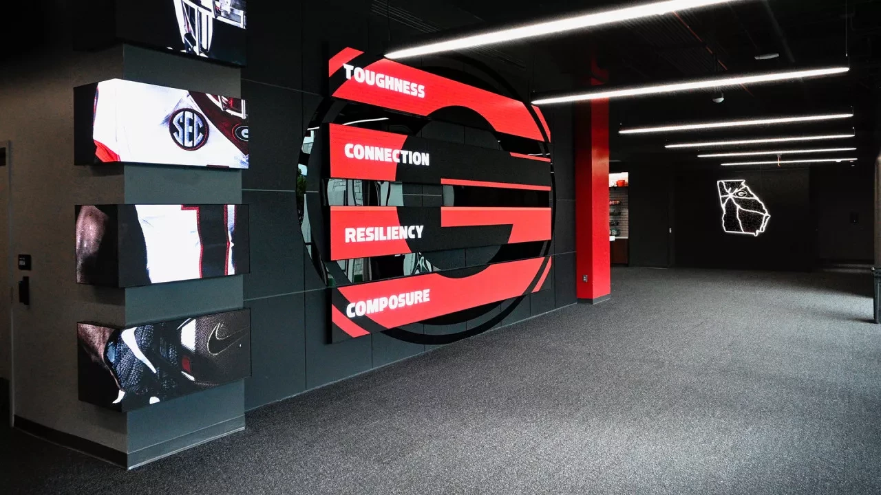 Technology board showcasing the Georgia 'G' and a football player