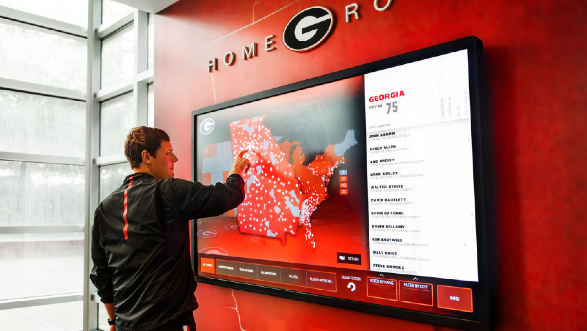man using a large touchscreen